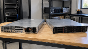 Two rackmount servers resting on an electronics workbench